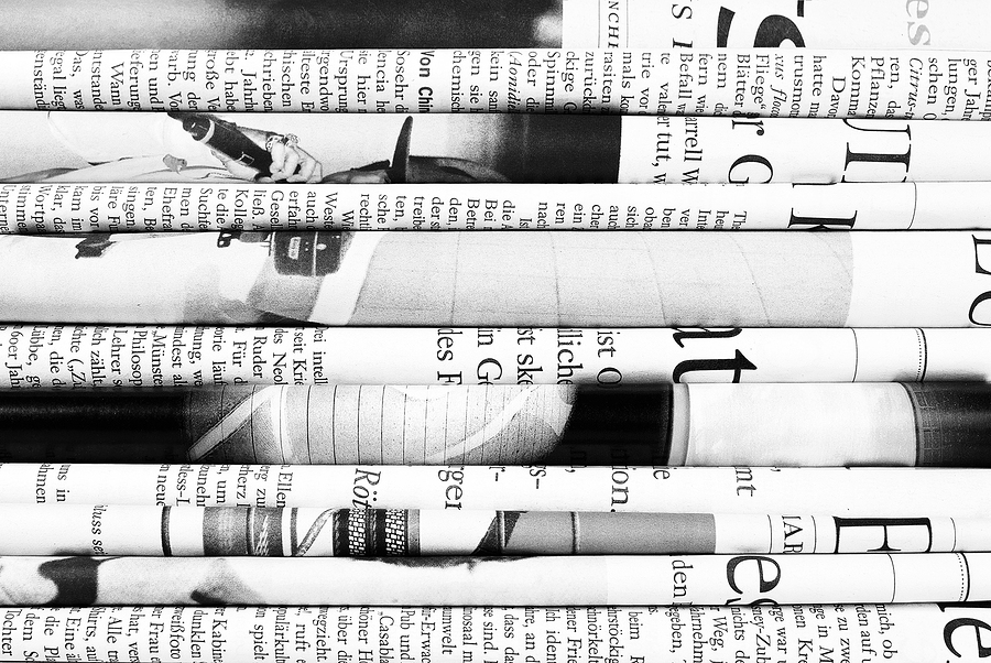 Pile of folded old newspapers